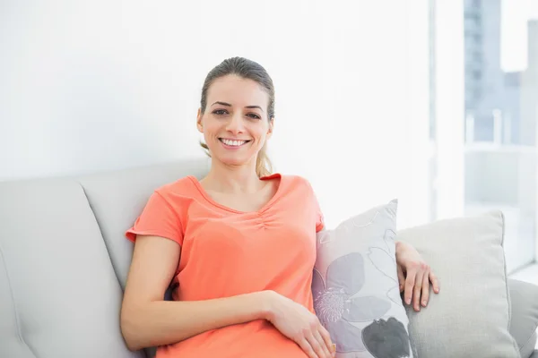 Content casual woman relaxing sitting on couch — Stock Photo, Image