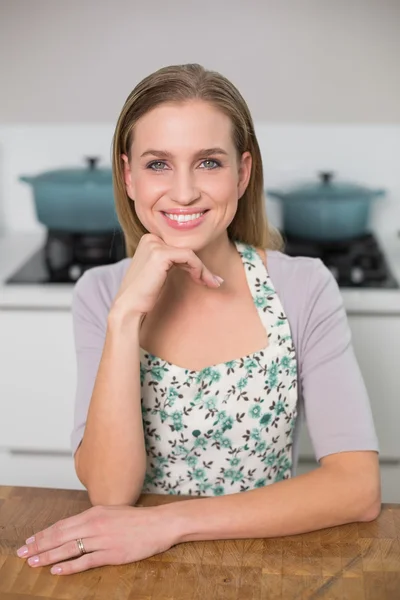 Cheerful gorgeous model sitting at table — Stock Photo, Image