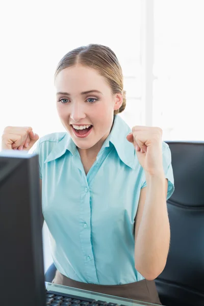 Classy happy businesswoman sitting in front of computer — Stock Photo, Image