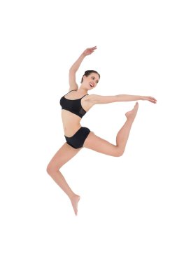 Sportif genç bir kadın olarak izole beyaz arka plan atlama