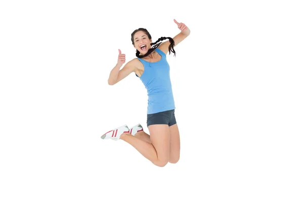 Active sporty woman gesturing thumbs up — Stock Photo, Image