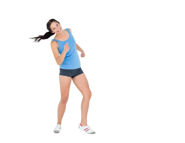 Mujer activa bailando sobre fondo blanco —  Fotos de Stock