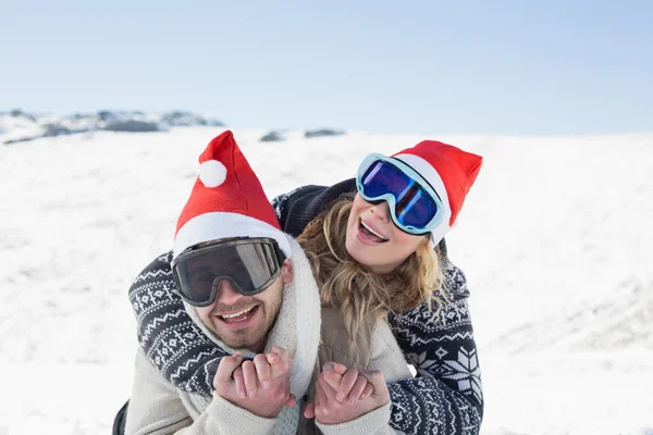 Close-up of a cheerful couple in ski goggles on snow — Stock Photo, Image