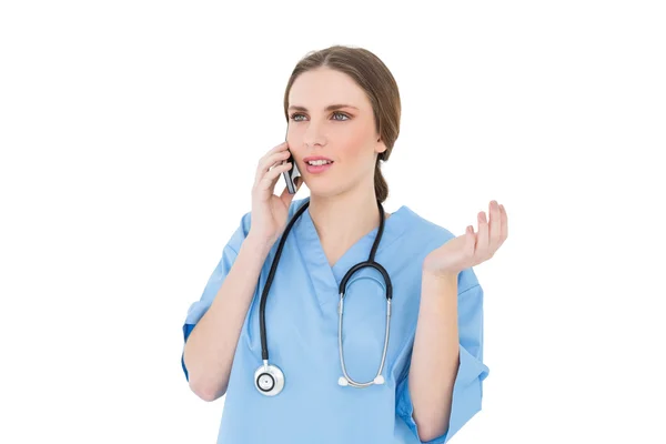 Young woman doctor phoning — Stock Photo, Image