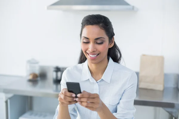 Content woman text messaging with her smartphone — Stock Photo, Image