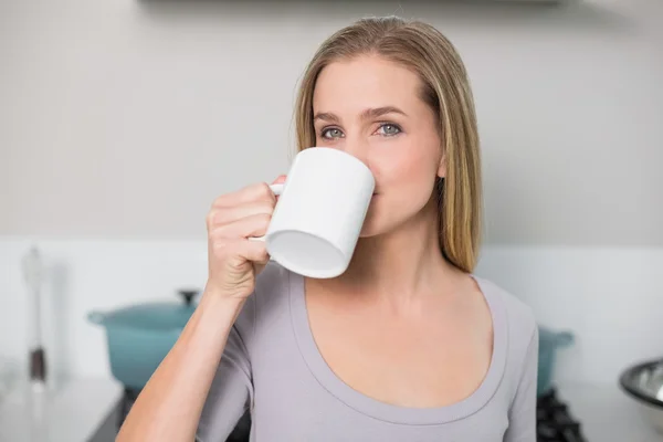 Calm gorgeous model drinking from mug — Stock Photo, Image