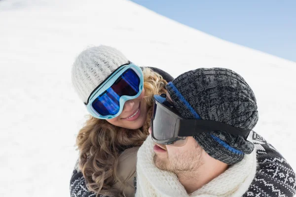 Close-up of a couple in ski goggles against snow — Stock Photo, Image