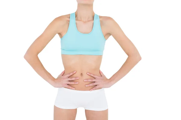 Mid section of slender woman wearing sportswear — Stock Photo, Image