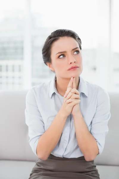 Serious well dressed woman looking up — Stock Photo, Image