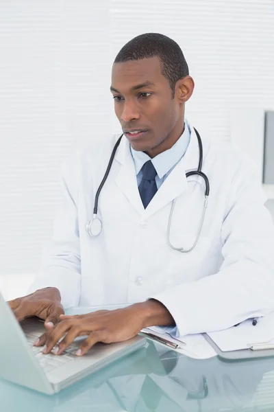 Doctor using laptop at medical office — Stock Photo, Image