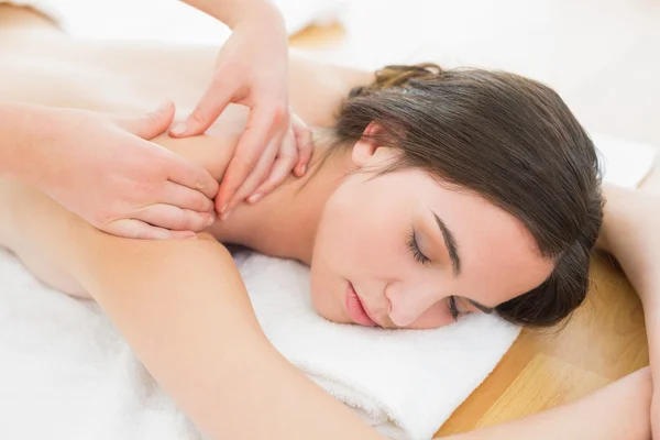 Woman enjoying back massage at beauty spa — Stock Photo, Image