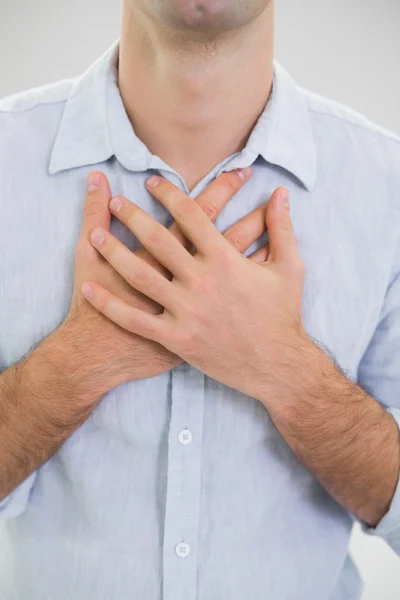 Mid section of a man with chest pain — Stock Photo, Image