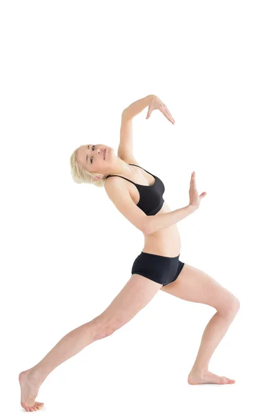 Full length portrait of a sporty young woman dancing — Stock Photo, Image