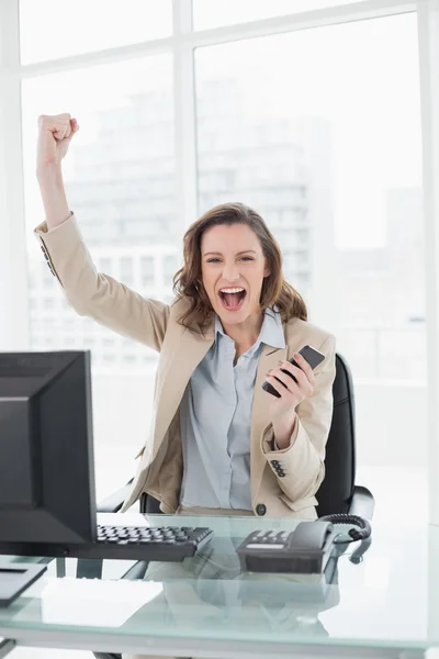 Portrait of an elegant businesswoman cheering in office — Stock Photo, Image