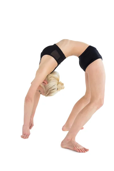 Fit young woman bending backwards — Stock Photo, Image