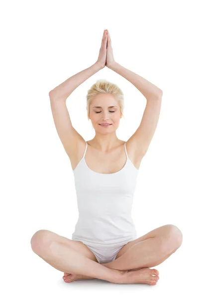 Sporty woman sitting in Namaskar pose with twisted hands — Stock Photo, Image