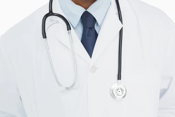 Mid section of a male doctor in lab coat and with stethoscope — Stock Photo, Image