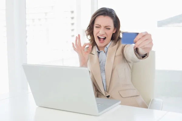 Businesswoman doing online shopping in office — Stock Photo, Image