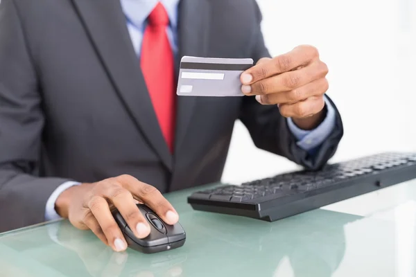 Close up mid section of a businessman doing online shopping — Stock Photo, Image