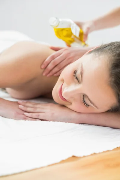 Close up of beautiful woman enjoying oil massage — Stock Photo, Image