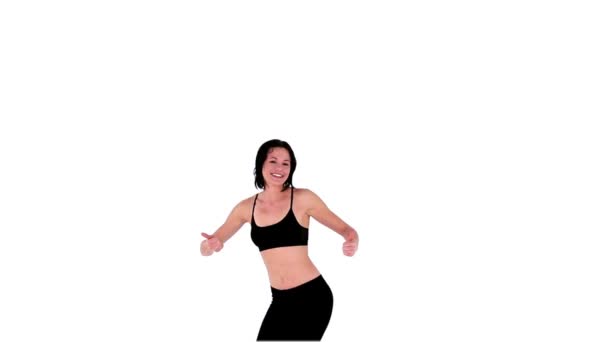 Slender attractive woman showing thumbs up while jumping — Stock Video