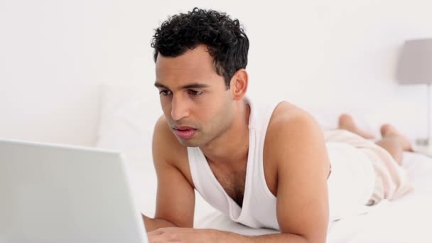 Attractive calm man using laptop — Stock Video