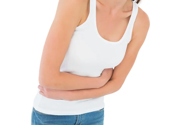 Mitte Abschnitt einer lässig Frau mit Magenschmerzen — Zdjęcie stockowe