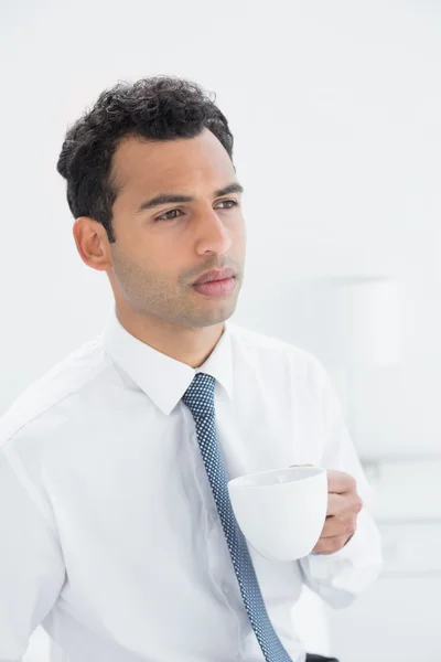 Serious well dressed man drinking coffee — Stock Photo, Image