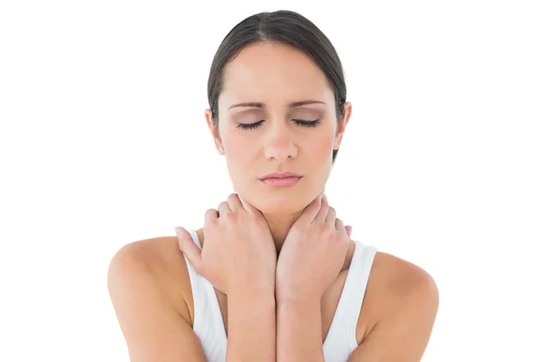 Close-up of a casual woman suffering from neck ache — Stock Photo, Image