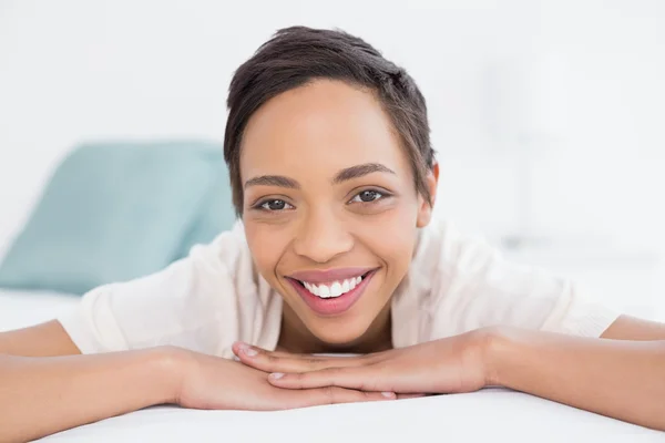 Close-up of a young woman resting in bed — Stock Photo, Image