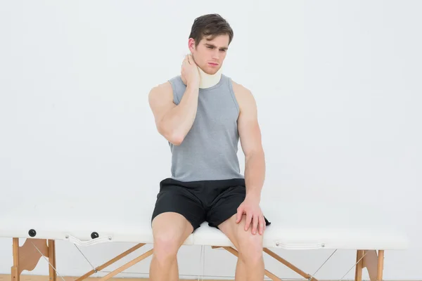 Handsome young man wearing cervical collar — Stock Photo, Image