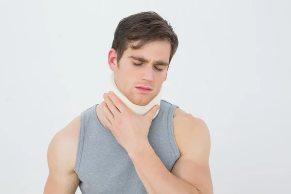 Handsome young man wearing cervical collar — Stock Photo, Image