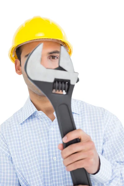 Close-up portrait of a young handyman with a wrench — Stock Photo, Image