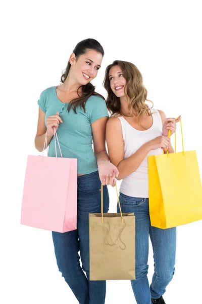 Two happy young female friends with shopping bags — Stock Photo, Image