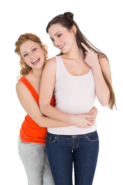 Cheerful female embracing her friend — Stock Photo, Image