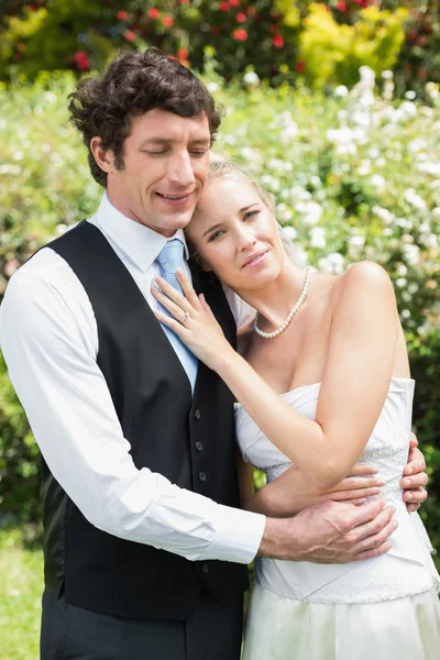 Romantic happy newlywed couple embracing each other — Stock Photo, Image