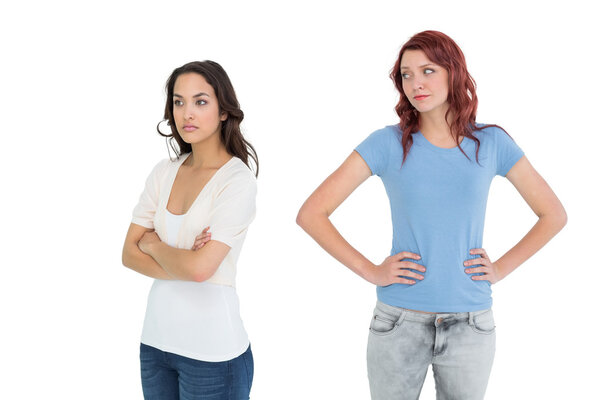 Unhappy young female friends not talking after argument