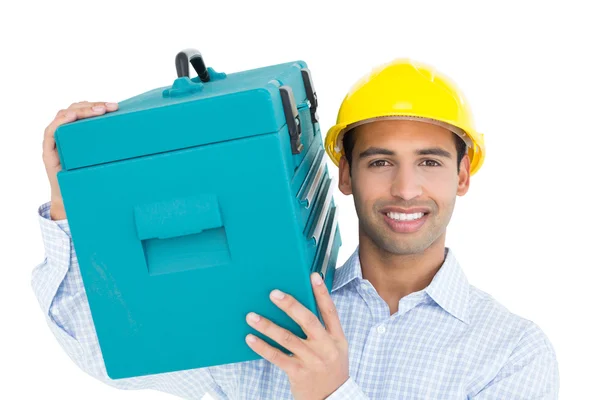 Manitas sonrientes en sombrero duro llevando una caja de herramientas — Foto de Stock