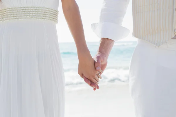 Newlyweds holding hands close up — Stock Photo, Image