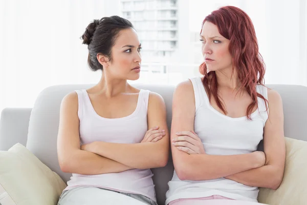 Unhappy friends not talking after argument at home — Stock Photo, Image