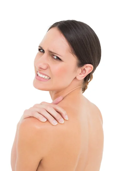 Close-up portrait of a topless woman with shoulder pain — Stock Photo, Image