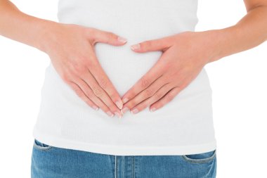 Mid section of a casual woman with stomach pain clipart