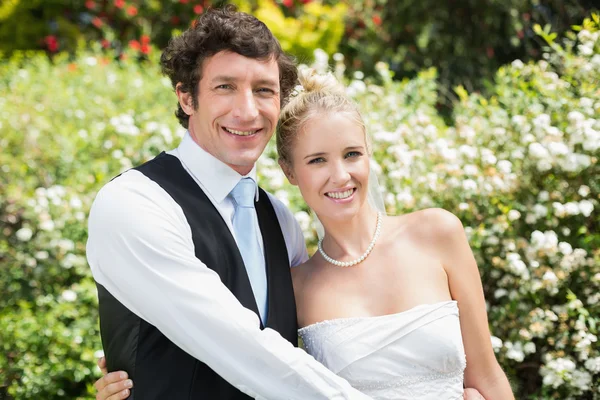 Romantic happy newlywed couple embracing each other — Stock Photo, Image