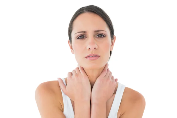 Portrait of a casual woman suffering from neck ache — Stock Photo, Image