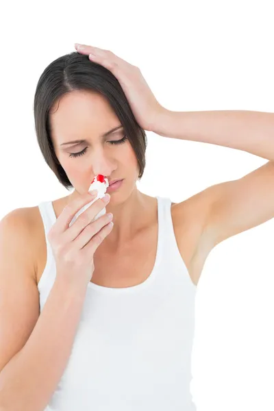 Casual young woman with bleeding nose — Stock Photo, Image