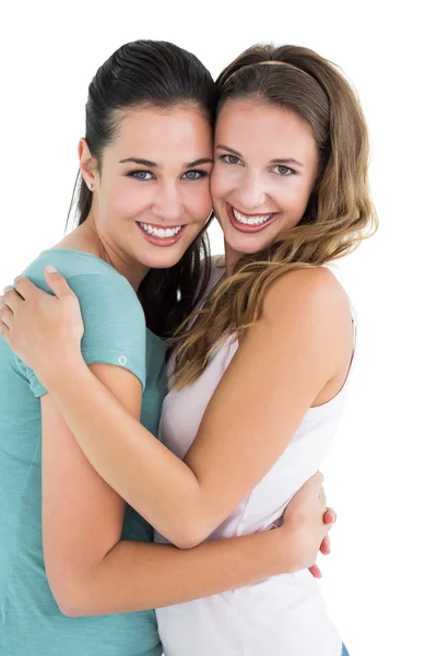 Side view portrait of a female embracing her friend — Stock Photo, Image