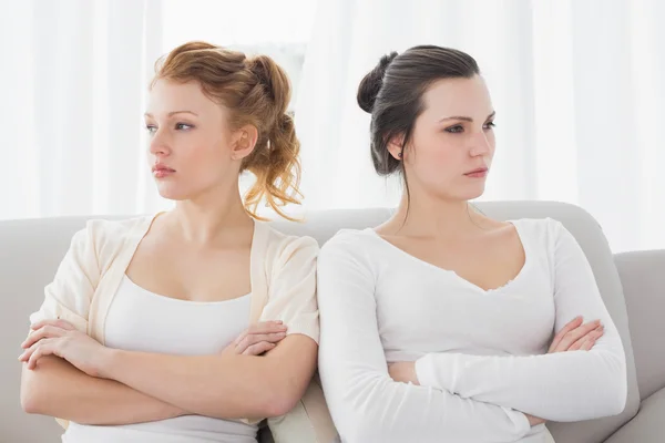 Unhappy friends not talking after argument on the couch — Stock Photo, Image