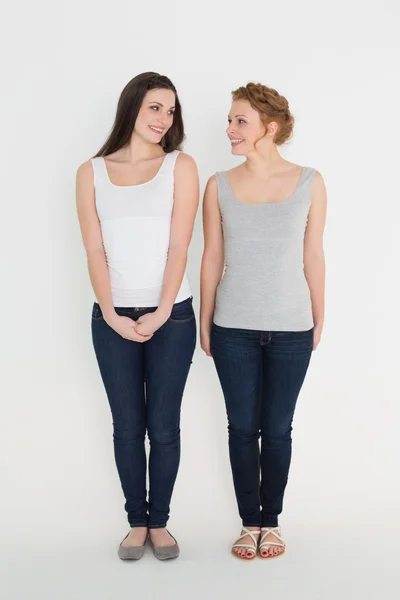 Full length of two casual young female friends — Stock Photo, Image