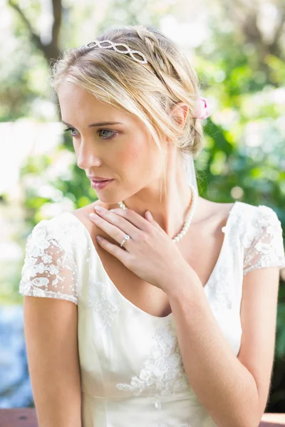 Content blonde bride with hand on chest — Stock Photo, Image