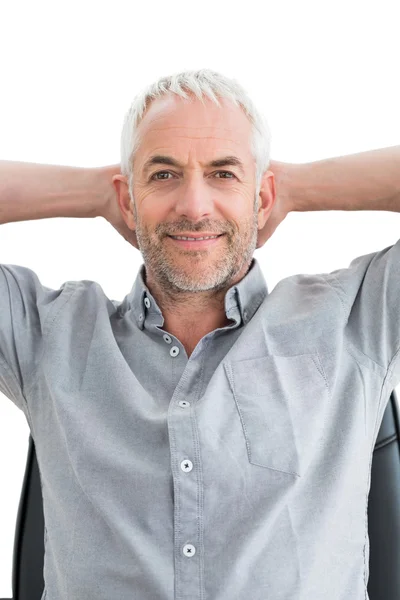 Relaxed mature businessman with hands behind head — Stock Photo, Image